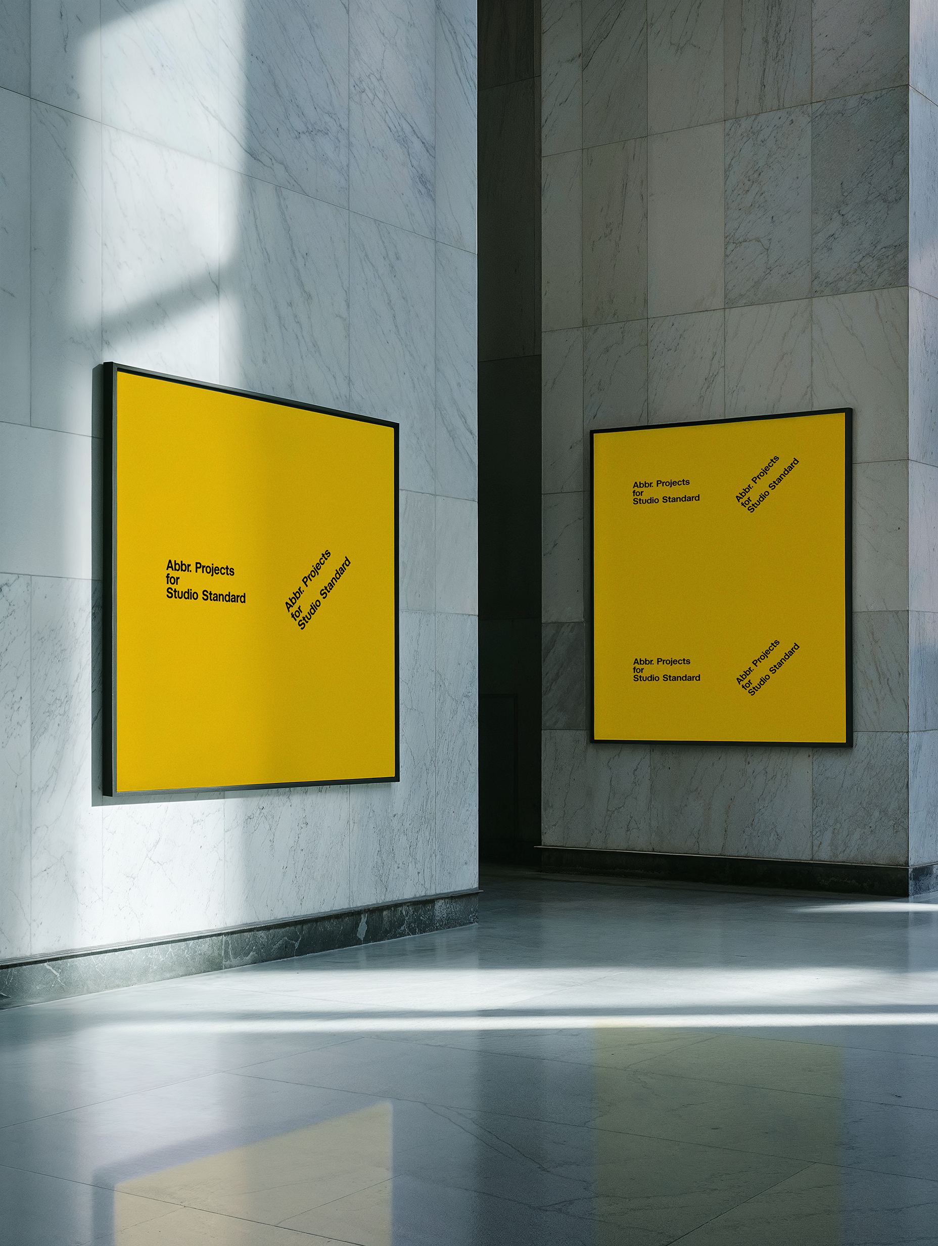 Gallery presentation mockup with two framed yellow posters in a marble-walled corridor by Simon Abranowicz