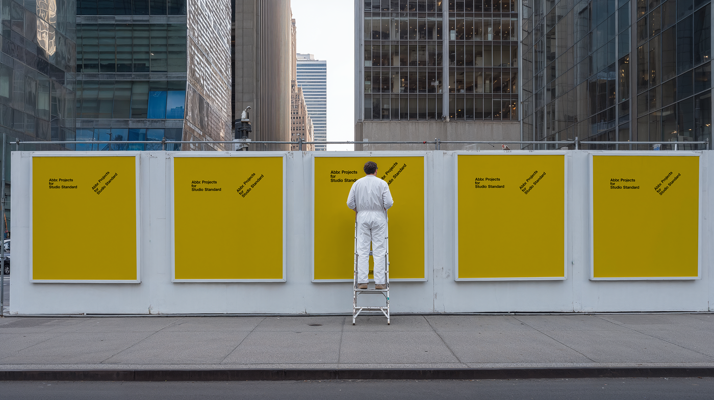 Street hoarding mockup with five yellow posters on a construction barrier, figure in white, city skyline behind