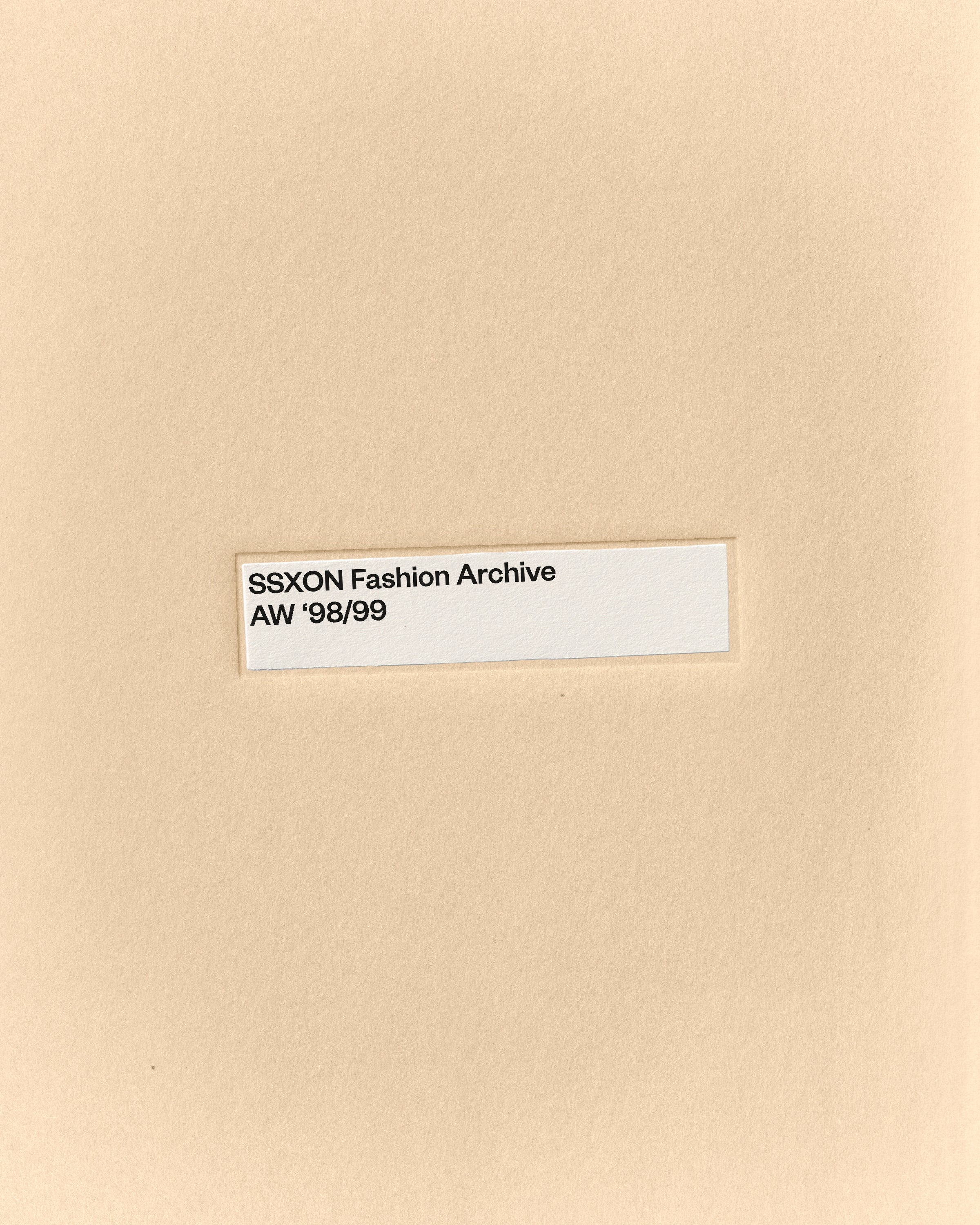 Minimal fashion archive mockup of a manila folder with centered label on warm paper texture by October November