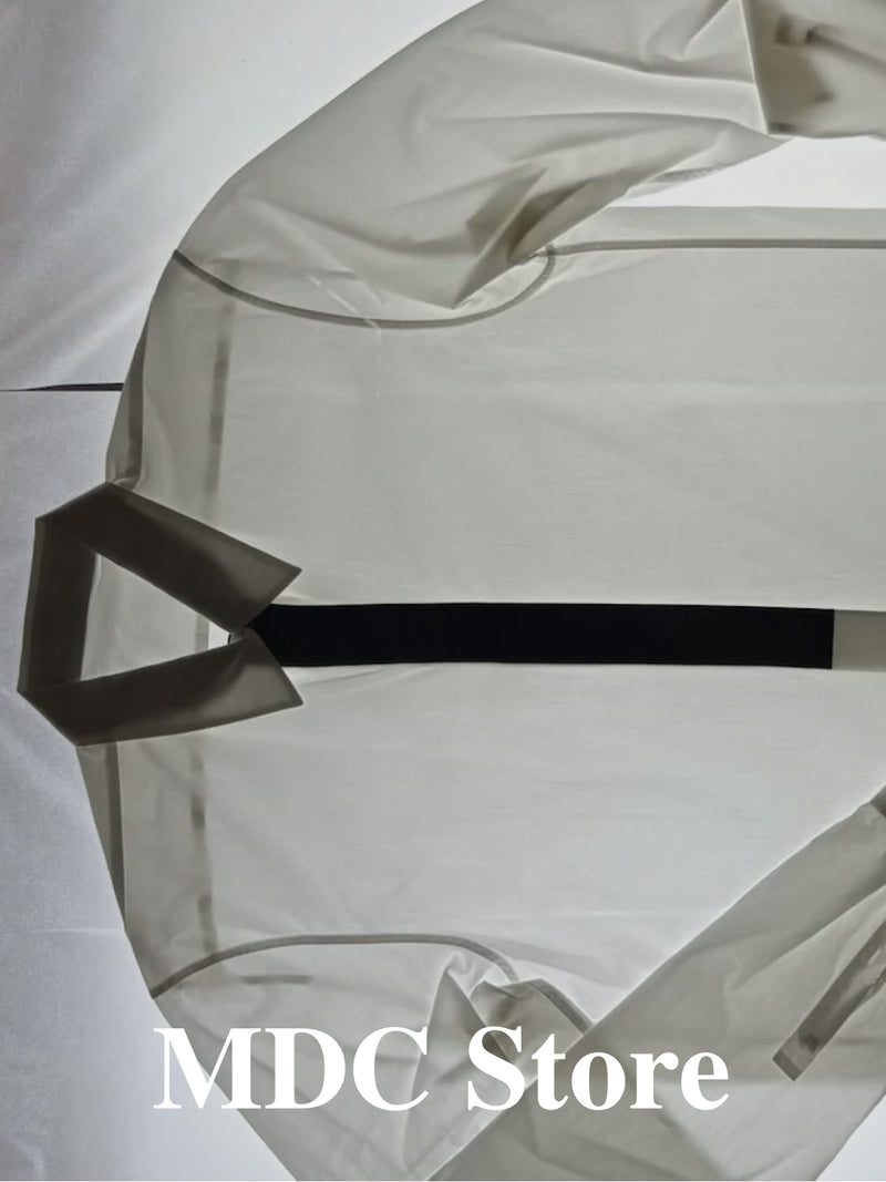 MDC Store white cotton shirt, flat lay product image art directed by Lisa Fessl