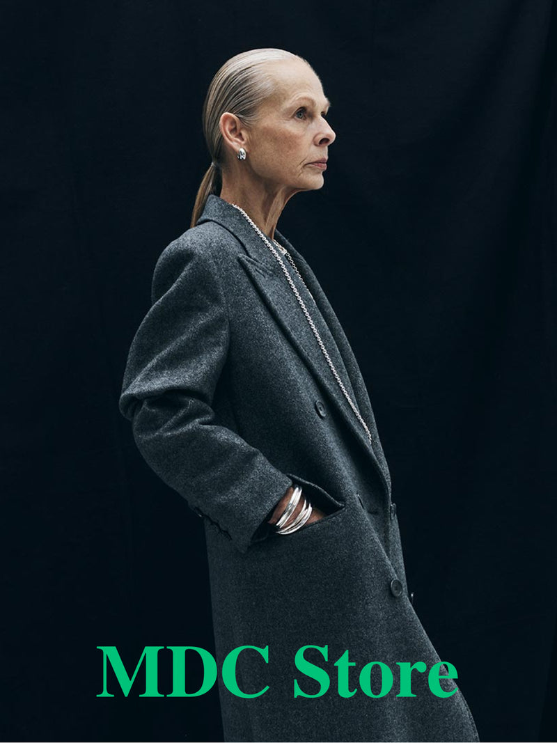 MDC Store gray wool coat photographed against black, art direction by Lisa Fessl
